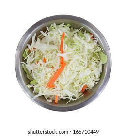 A Top View Of A Stainless Steel Bowl Filled With  Cole Slaw  And Fresh Cut Carrot Sticks On A White Background.