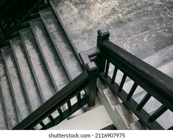 Top View Of A Stair With Black Wood Railing