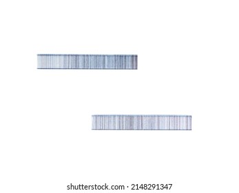 Top view of staples for a mechanical construction stapler lying on a white background.