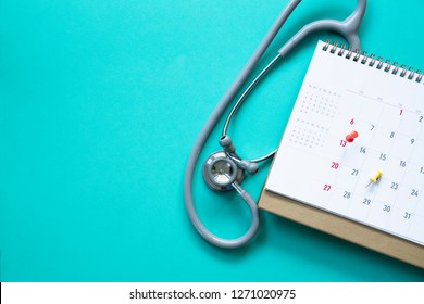 Top View Of Stethoscope And Calendar On The Green Background, Schedule To Check Up Healthy Concept