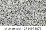 Top view Stone texture background for making concrete for home. Pile of grey stones as background. Crushed stone, commonly referred to as split stone, is often used for making foundations mixed. 