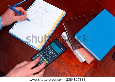Top view of a student's calculation of a complicated math task