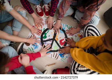 Top view students making poster peace sign at school 