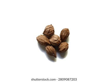Top view studio shot of a small group of dry organic hicaco seeds or Chrysobalanus icaco endocarps isolated on white background from Guatemala.