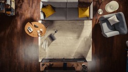 Top View Of A Stylish Apartment With Tastefully Decorated Interior, Coffee Mug, And Laptop On The Floor. No People Conceptual Shot Of A Modern Loft Living Room. Space For Home Office Or Relaxation.