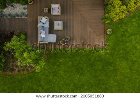 Similar – View of a garden through a fly screen