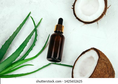 Top View Summer Cosmetics Flat Lay Oil Bottle,coconut And Aloe Vera Leaves 