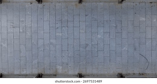 top view of the surface of a pedestrian path with paving slabs