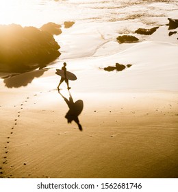 Top view of a surfer on the beach - Powered by Shutterstock