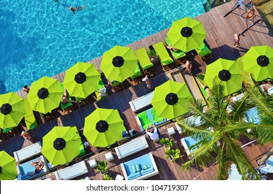 Top View Of Swimming Pool Side With A Seat And Umbrella