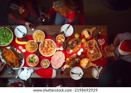 Top view of Table of roast turkey and food in christmas and new year party of American family at home, family member enjoy home made turkry grill dining togather in house
