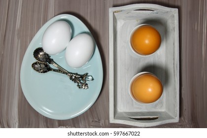 Top view of a  table setting of plates and eggs for breakfast