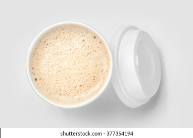 top view of takeaway paper cup mix hot latte coffee foam, white background