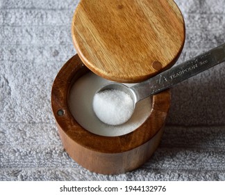 A top view of a teaspoon of salt