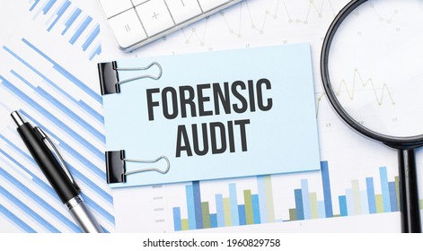 Top View Of Text Forensic Audit With Calculator, Magnifying Glass And Pen On Financial Charts . Business, Calculation, Strategy, Searching And Tax Concept. Top View.