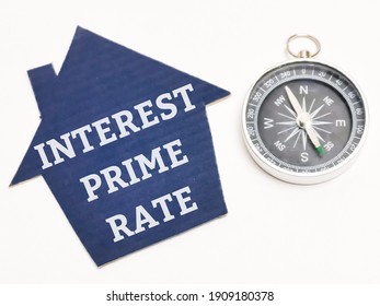 Top View Text INTEREST PRIME RATE On Cupboard House With Compass. Property Concept.