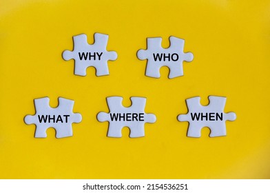 Top View Of Text On Missing Jigsaw Puzzle - Why, Who, What, Where And When. Fact Finding Concept