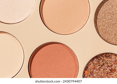 Top view texture pattern with different eye shadow swatches, multi colors palette in beige plastic package. Close up eyeshadows powder for makeup, cosmetics texture design, beauty background, flat lay - Powered by Shutterstock