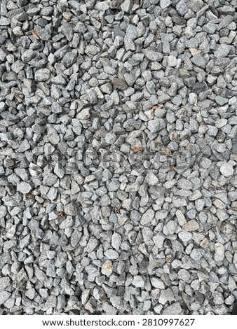 Top view texture of small grey pebbles gravel background