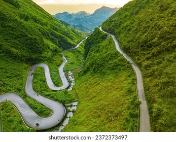 Top view of Tham Ma mountain pass in Ha Giang province, north of Vietnam. A famous tourist destination of Ha Giang province. Curvy road on Ha Giang Loop Motorbike tour