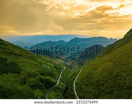 Top view of Tham Ma mountain pass in Ha Giang province, north of Vietnam. A famous tourist destination of Ha Giang province. Curvy road on Ha Giang Loop Motorbike tour