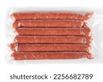 Top view of thin semi-smoked sausages in vacuum packaging.