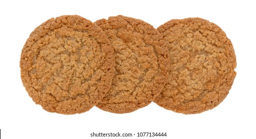 Top View Of Three Apple Pie Crust Cookies In A Row Isolated On A White Background.