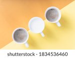 Top view - Three cups of different kind of coffee on color background.