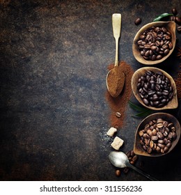 Top view of three different varieties of coffee beans on dark vintage background - Shutterstock ID 311556236