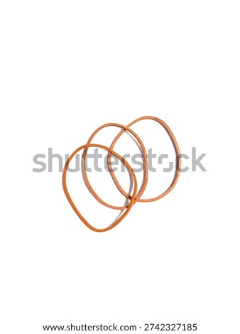 Top view of three interlinked orange rubber bands for office and household use, isolated on white background