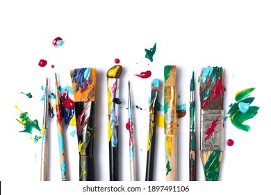 Top View Of Tool For Artist, Different Size Used Brushes With Colorful Paint For Art And Drawing On White Background