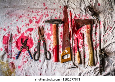Top view of torture tools placed on bloody cloth