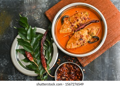 Top View Of Traditional Sri Lankan Fish Curry King Fish Curry, Sri Lanka On White Background. Hot And Spicy Homemade Yellow Fish Curry With Gravy Made Using Coconut Milk , Gambooge, Turmeric.