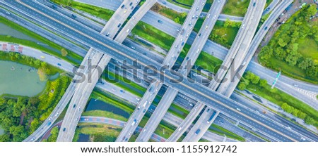 Top view Traffic trails on highway intersection