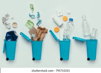 top view of trash bins and assorted garbage isolated on grey, recycle concept - Shutterstock ID 795715315