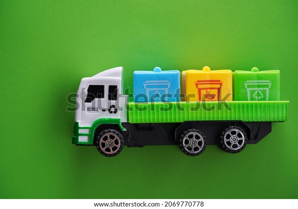 top view of trash truck on green background             \
          