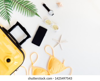 Top View Travel Concept With Bikini, Luggage And Outfit Of Traveler On White Wooden Background, Tourist Essentials, Vintage Tone Effect