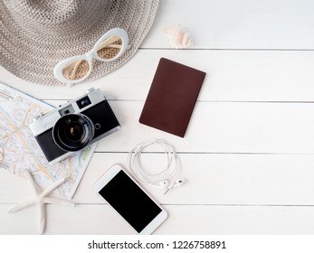 Top View Travel Concept With Retro Camera Films, Map, Passport, Smartphone On White Table Background With Copy Space, Tourist Essentials, Vintage Tone Effect