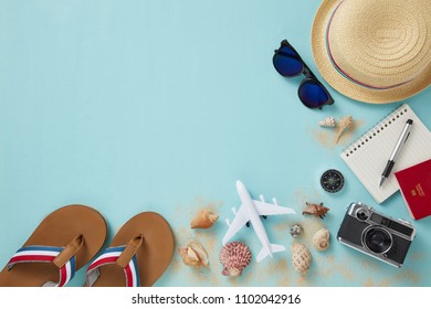 Top View Of Travel Gadgets On Blue Background For Travel Concepts