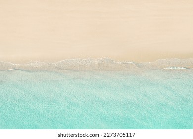 Top view of tropical Seychelles sand beach. Blue, turquoise transparent water surface of ocean, sea, lagoon. Horizontal background. Aerial, drone view