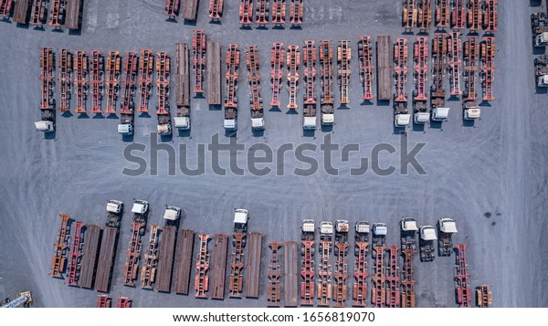  Top\
view  Trucks and containers at the\
warehouse