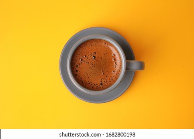 Top View Of Turkish Coffee Placed On Yellow Background