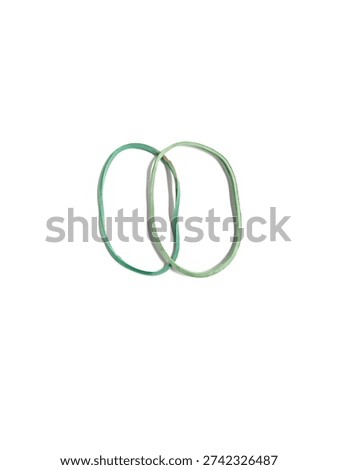Top view of two interlinked green rubber bands for office and household use, isolated on white background