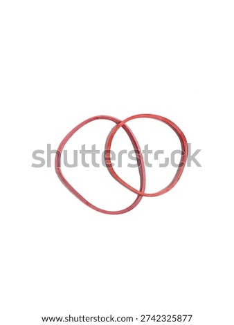 Top view of two interlinked red rubber bands for office and household use, isolated on white background