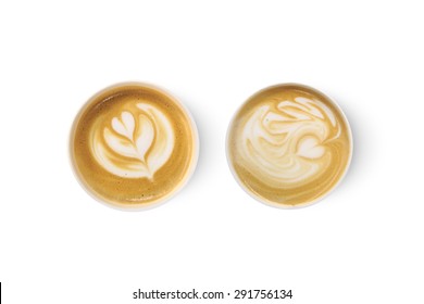 Top view of two latte art coffees with heart figure, isolated on white background.