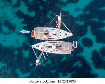 top view of two sailboats anchored at sea - Powered by Shutterstock