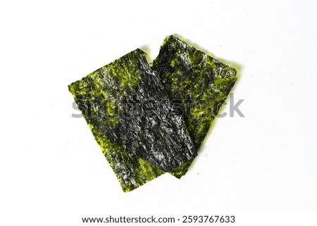 Top view of two sheets of nori dried seaweed isolated on white background. Clipping path. Asian food. Flat lay. Healthy Snack.