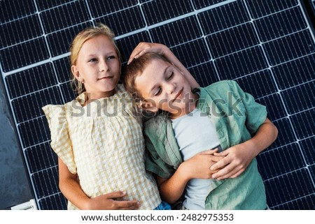 Similar – Image, Stock Photo Two solar panels lying in the green grass