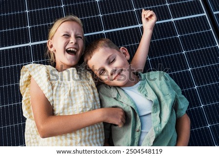 Similar – Image, Stock Photo Two solar panels lying in the green grass