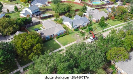 Top View A Typical Established Residential Neighborhood In Suburbs Dallas, Texas, America. Aerial View Working Truck With A Lift Cutting Down Tree, Pruning And Landscaping Service